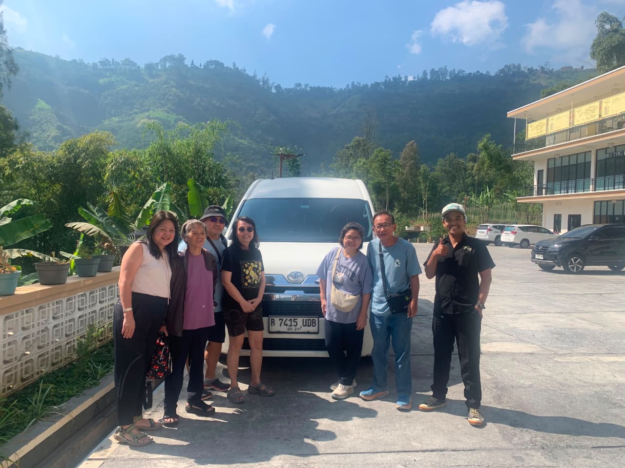 Ms rosie from taiwan and her group with the rental vehicle and driver during their bromo journey
